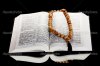 depositphotos_8114020-Russian-open-holy-bible-with-wooden-rosary-on-black-backround.jpg